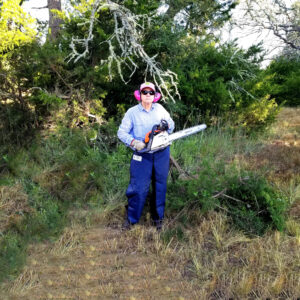 inept woman with chainsaw